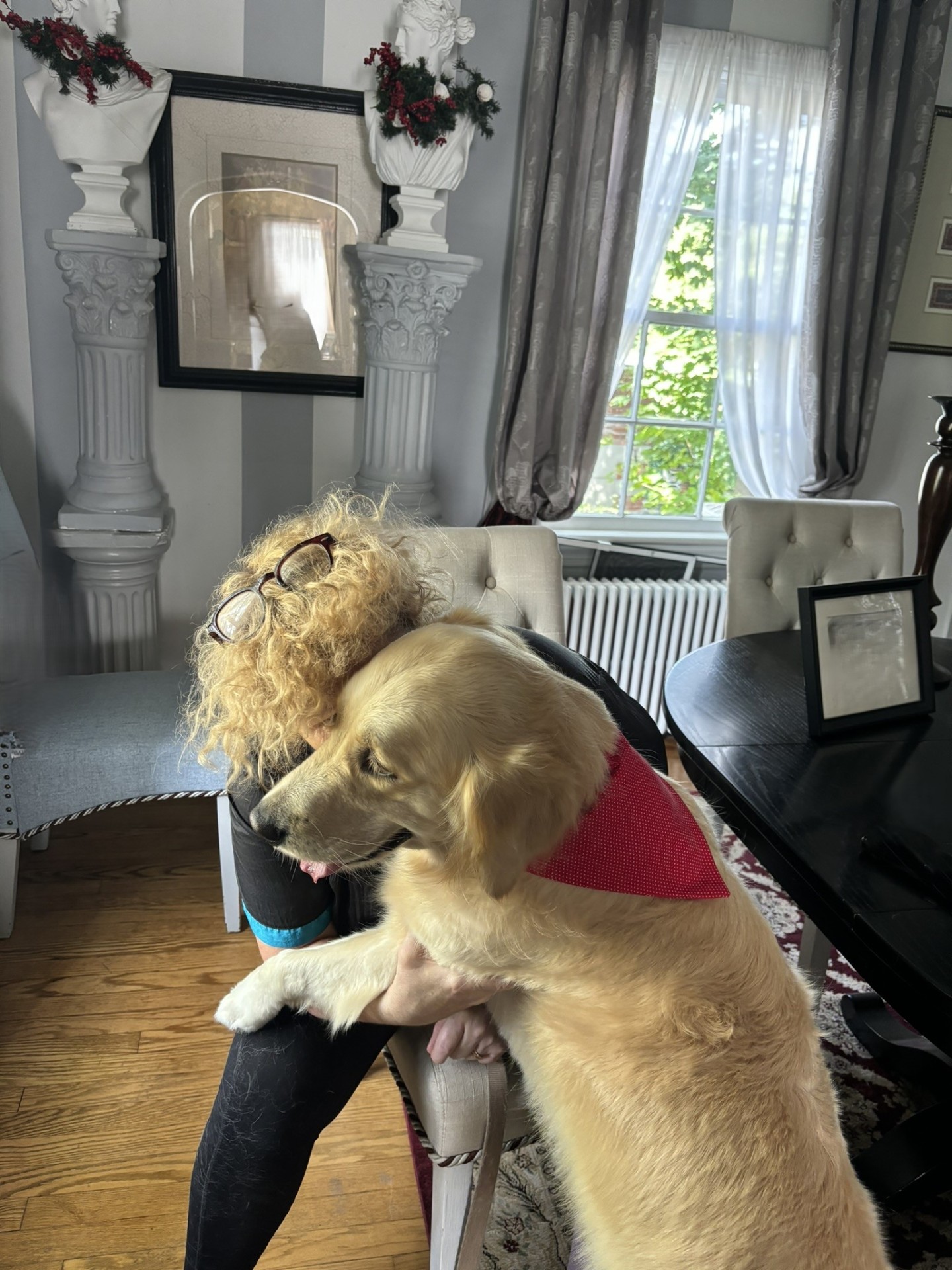 Colette, owner and groomer at Ketsie's Pet Retreat, with a client